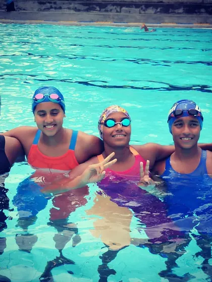 A happy moment in the pool after a tough training session. Team spirit and friendship are a huge part of our coaching philosophy at Dolphin Aquatics.