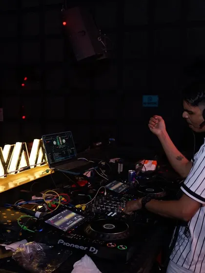 A side view of my setup at Maya, with the club's logo in the background.