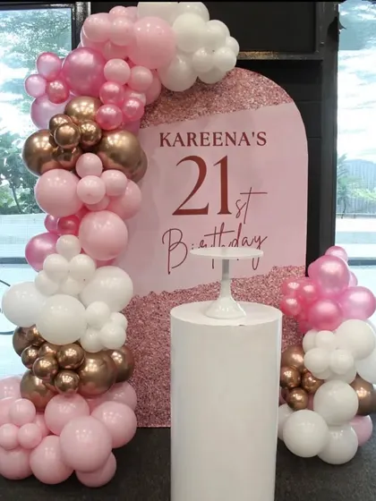 A chic and stylish 21st birthday for Kareena. This setup uses a custom arch backdrop with a beautiful balloon arrangement in rose gold, pink, and white.