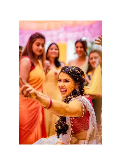 Surrounded by friends and covered in haldi. I help you plan for these moments so you can be fully present and enjoy the celebration with your loved ones.
