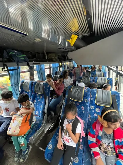 The journey is part of the adventure. Children travel together on the bus to the pet sanctuary, building social skills and anticipation for the day of learning ahead.