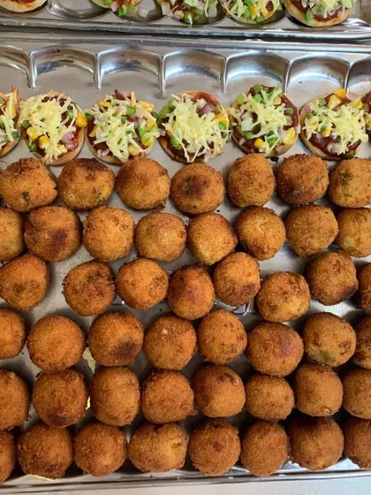 A closer look at the Mini Veggie Pizzas and Corn & Cheese Balls, ready to be devoured.