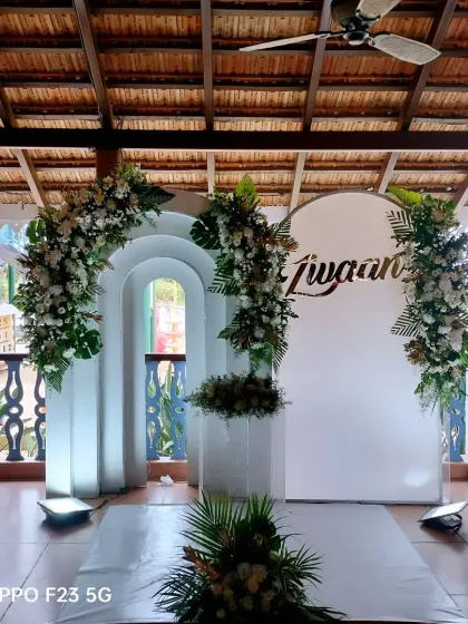 A serene and elegant setup for little Zivaan's Holy Baptism. We used pure white architectural backdrops and lush white floral arrangements to reflect the sacred beauty of the occasion.