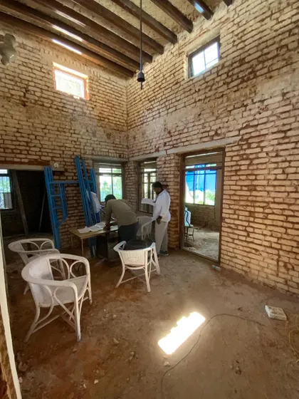 The start of a restoration project on a 100-year-old villa. Here, we've carefully removed the old plaster to expose the original brickwork, preserving the beautiful old rafters while planning for a new, thoughtful layout.