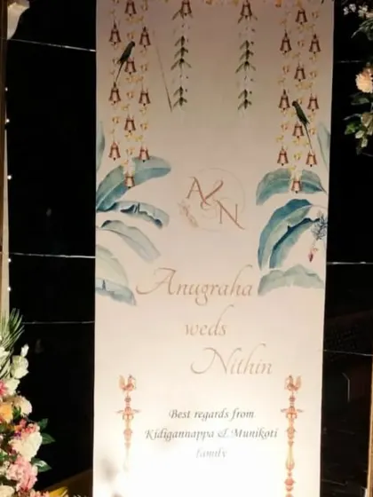 A personalized welcome sign for Anugraha and Nithin's wedding, featuring beautiful illustrations and framed by delicate floral decor.