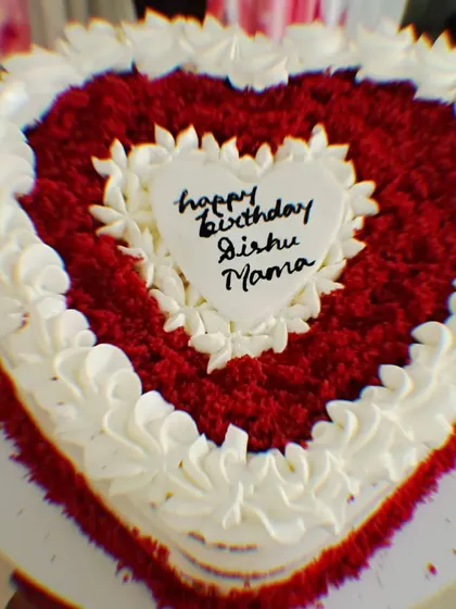 A classic heart-shaped red velvet cake with cream cheese frosting, perfect for showing someone you love them.