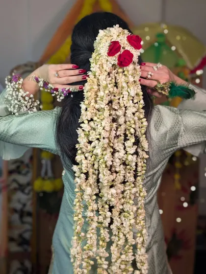 The full view of the dramatic 4-foot long floral hairstyle.