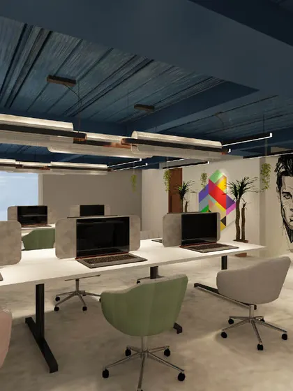 An open-plan workstation area with colorful chairs and abstract art. The design aims to foster creativity and collaboration in a bright and energetic setting.