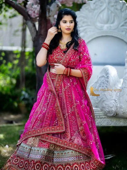 A full view of the pink and red lehenga, perfect for a grand, celebratory pre-wedding look.
