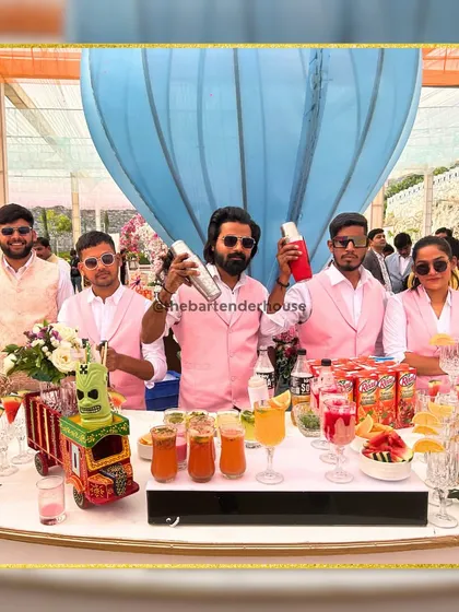 Meet the team. Dressed in pink to match the event's theme, my crew is ready to shake, pour, and serve with smiles and professionalism.