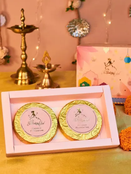 My Florentine Box is a simple yet elegant gift. It contains two large, handcrafted chocolate florentines, one with almonds and the other with cashews, for a nutty, chocolatey treat.