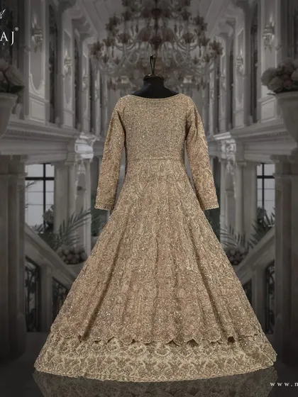 The back view of the light gold Indo-Western ensemble, highlighting its intricate design and craftsmanship.