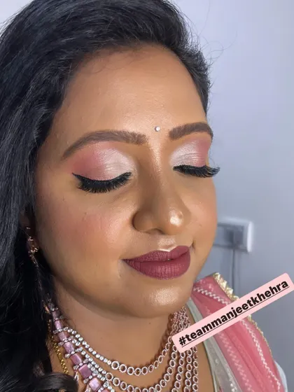The pink and silver eye makeup is a perfect choice for an elegant evening reception.