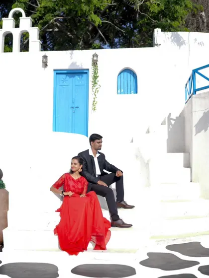 A classic couple's portrait against a clean white and blue backdrop, perfect for a timeless pre-wedding album.