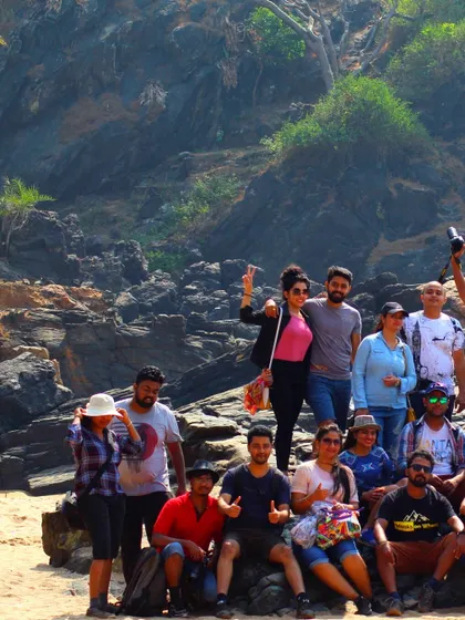 A candid group photo from the Gokarna beach trek, showing a team of adventurers enjoying their coastal journey.