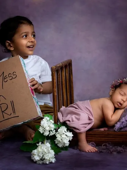 We always have a little fun during our sibling photoshoots! This big brother is already so protective of his little sister. This playful shot captures his personality perfectly and tells a sweet story about their future together.
