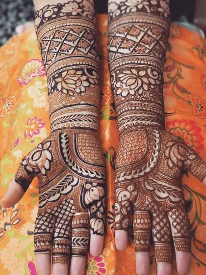 This intricate design features lotus flowers and elephants, both deeply symbolic in Indian weddings, combined with detailed check patterns.