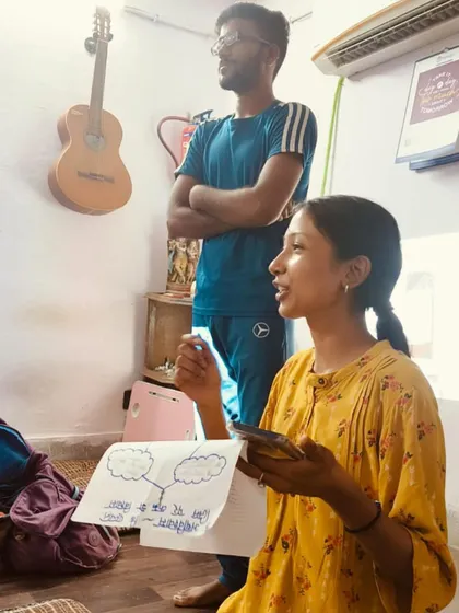 Two participants collaborate on a presentation. The 'Be A Jagrik' journey is about peer learning, creative expression, and building the confidence to speak up on important issues.