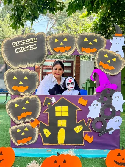 Getting into the Halloween spirit. This mother and child duo, with fantastic face paint, pose at our 'Spooktacular' photo booth during the workshop.