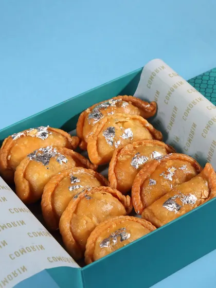 Our special Gujiya Boxes for Holi. These traditional sweet pastries are filled with khoya and nuts, making them a perfect festive gift or treat for your celebrations.
