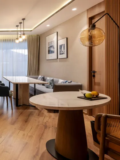 Additional views of the Radisson Resort, Khopoli, showcasing various interior and exterior details, from lobby seating areas and restaurant layouts to guest room configurations and architectural elements.