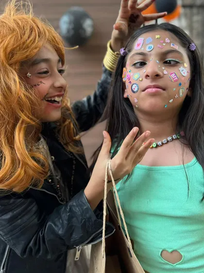 Getting ready for the party with fun face stickers and a cool rockstar wig. I encourage all the kids to express themselves and have fun with their looks.