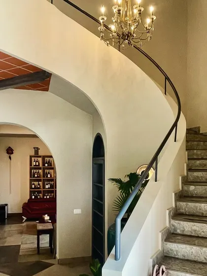 A duplicate image of the elegant spiral staircase, which acts as a sculptural element within the home.