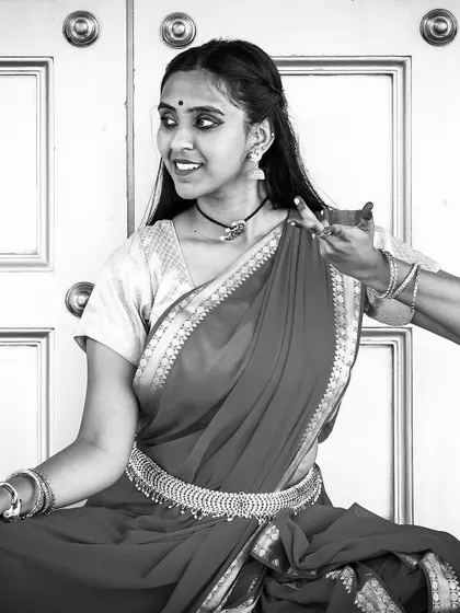 A black and white portrait from a traditional photoshoot. The hand gestures, or mudras, are a key part of classical Indian dance, and I incorporate simplified versions into my choreography.