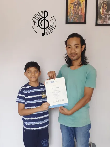 Achievement unlocked! Congratulations to Revanth for passing the RSL Entry Level exam with Distinction in Acoustic Guitar. Your hard work has truly paid off.