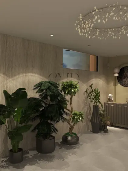 The passageway, leading to the pool and terrace, is designed as an experience with lush greenery, a wooden credenza, and unique clay light fixtures.