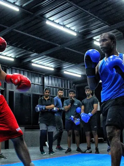 Two of our competitive boxers facing off in a sparring session. The focus and intensity here are what prepare them for actual matches.