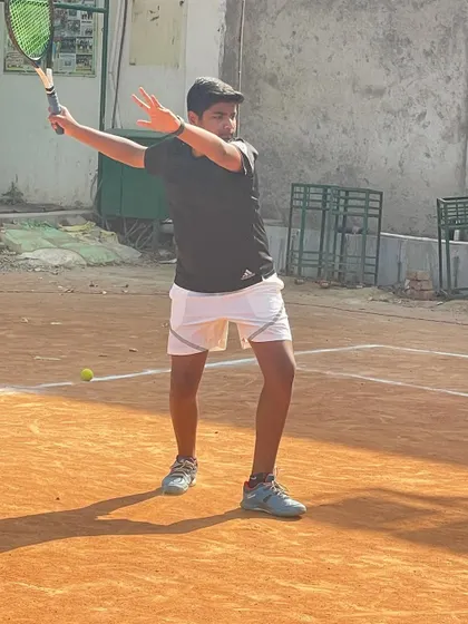 A player hitting a clean backhand during practice. Notice the balance and preparation before the shot.