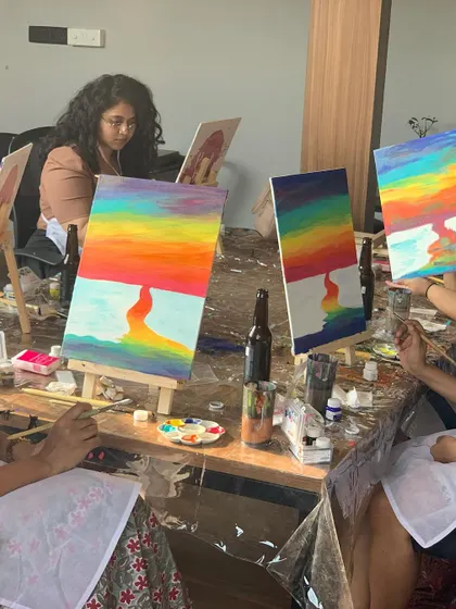 A table full of colorful paintings at our Demy Cafe Bar workshop in Mumbai. The vibrant results speak for themselves.