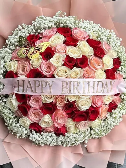Another angle of the grand round bouquet, highlighting the custom "Happy Birthday" ribbon that makes this stunning arrangement a truly personal gift.