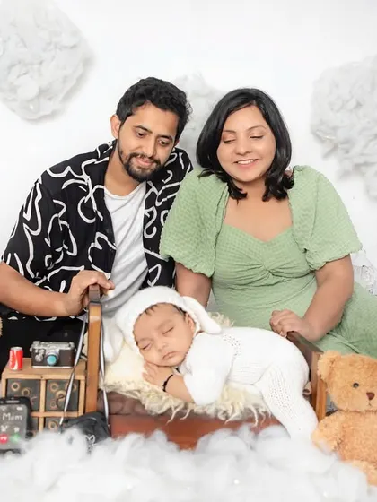 A family adoring their newest member. In my themed setups, I always make time for family portraits to capture the love that fills the room.