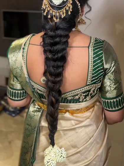 A thick, traditional braid perfect for a bride. We practice techniques to add volume and length using extensions, ensuring a rich and full look.