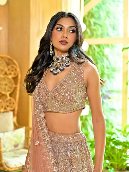 A close-up of the stunning reception makeup. The focus is on the beautifully blended eyeshadow and the flawless, glowing skin.