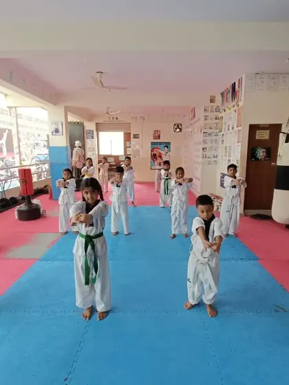 Students practicing a wrist-releasing technique, an important part of self-defense.