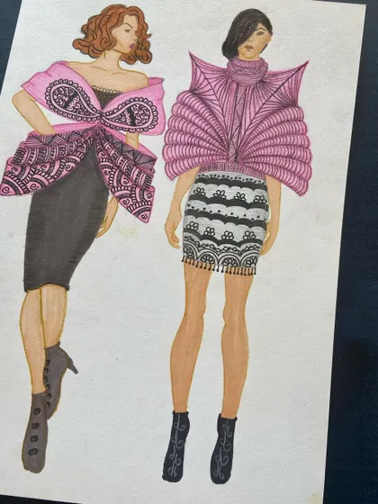 Two imaginative designs featuring large, structured elements inspired by lace and fan shapes.