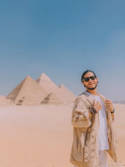 This self-portrait in front of the Great Pyramids of Giza shows my ability to create striking travel content anywhere in the world. It demonstrates how I integrate myself or a subject into iconic landscapes to create aspirational lifestyle imagery.
