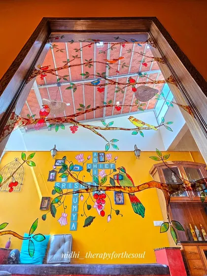 This was a huge and exciting project. I created this large-scale glass painting of tropical birds on branches for a penthouse terrace window, turning it into a permanent piece of art that filters the light beautifully.