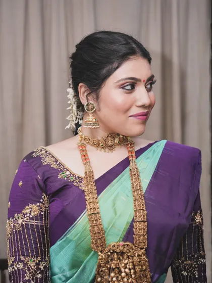 A three-quarter view showing the subtle glam of this makeup. The skin has a natural, healthy glow, and the eye makeup is just enough to make her eyes pop.