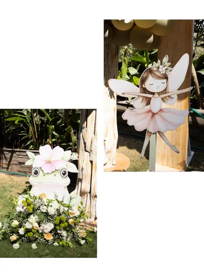 A closer look at our custom-made props for an enchanted forest theme, featuring a friendly frog and a delicate fairy cutout.