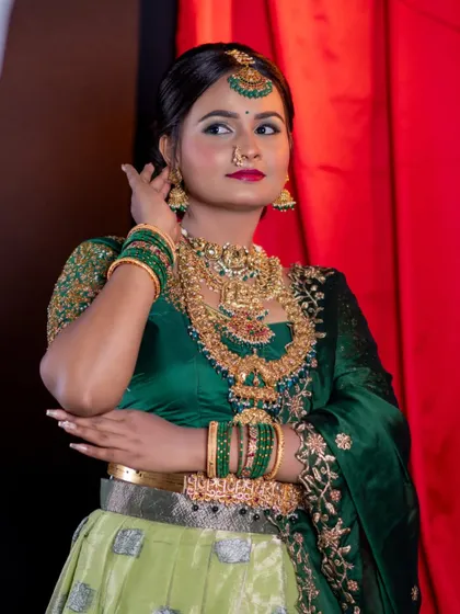 A three-quarter view of the green lehenga look.