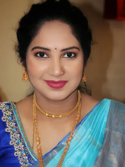A close-up portrait of Lavenya, highlighting the soft and natural makeup that makes her skin glow.