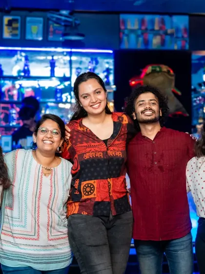 A group of friends enjoying their night out. The bar in the background is always a hub of activity and great drinks.