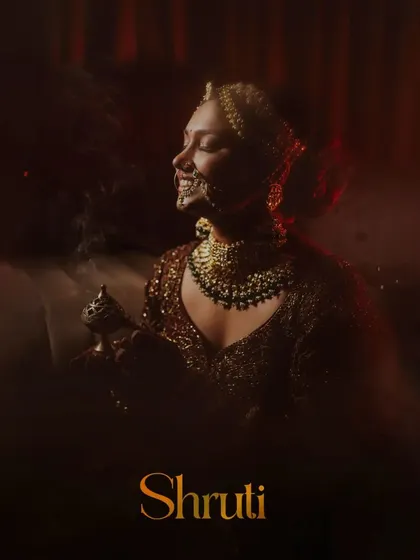 A beautiful, moody portrait of the bride, with her name elegantly displayed.