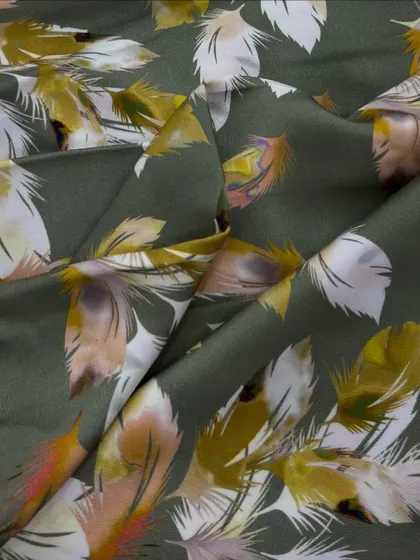 This rayon satin with a unique feather print in earthy tones offers a sophisticated and artistic look. Its smooth drape is perfect for elegant silhouettes.