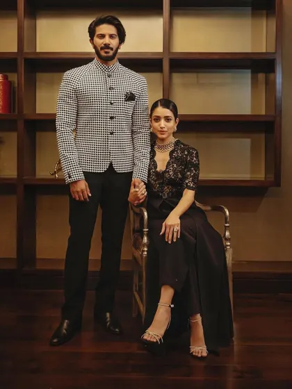 A beautiful portrait of the stylish couple, Dulquer and Amaal, showcasing their coordinated and elegant ensembles.