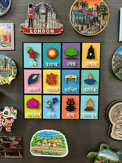 I love seeing how my clients use my creations! Here is my Marathi months calendar displayed on a fridge, surrounded by travel magnets.